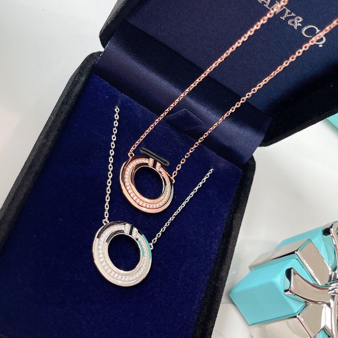 TIFFANY DIAMOND AND MOTHER OF PEARL CIRCLE PENDANT