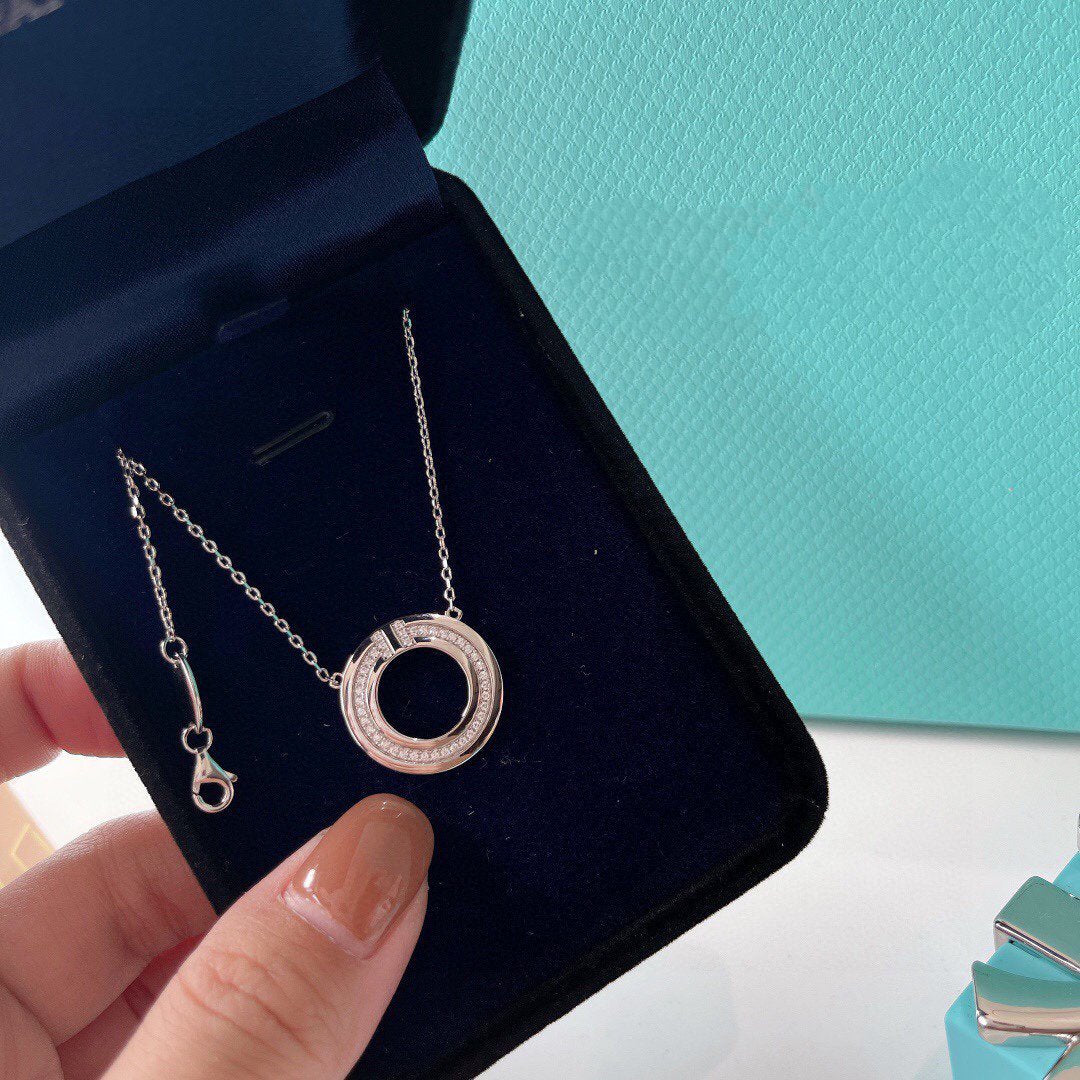 TIFFANY DIAMOND AND MOTHER OF PEARL CIRCLE PENDANT