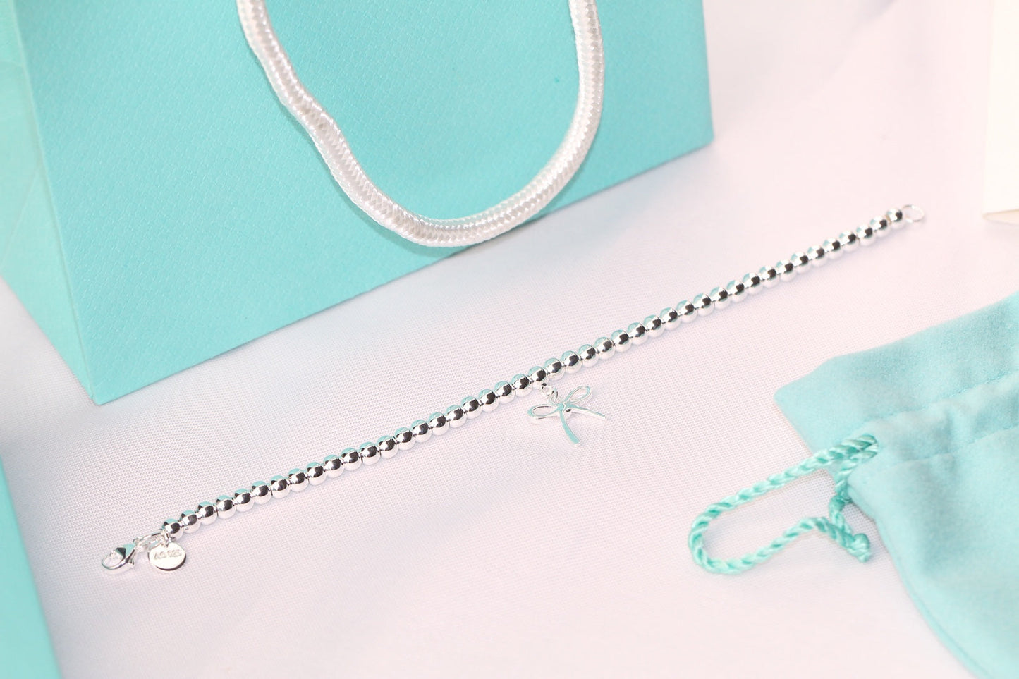 TIFFANY STERLING SILVER BOW BEAD BRACELET