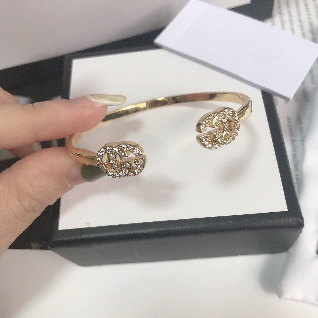 GUCCI GOLD RUNNING DIAMOND LOGO BANGLE BRACELETS