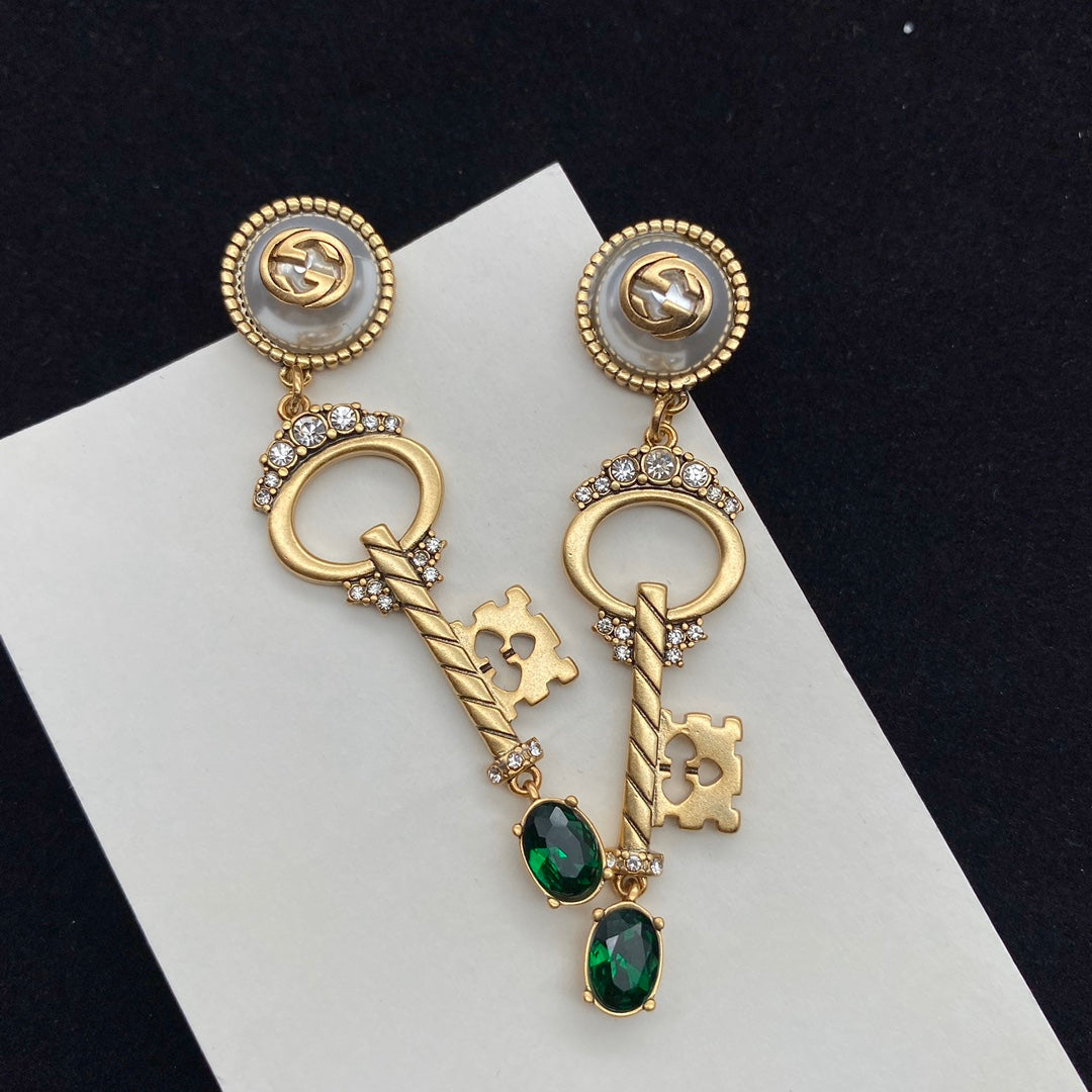 GUCCI KEY SHAPED DANGLE GG EARRING