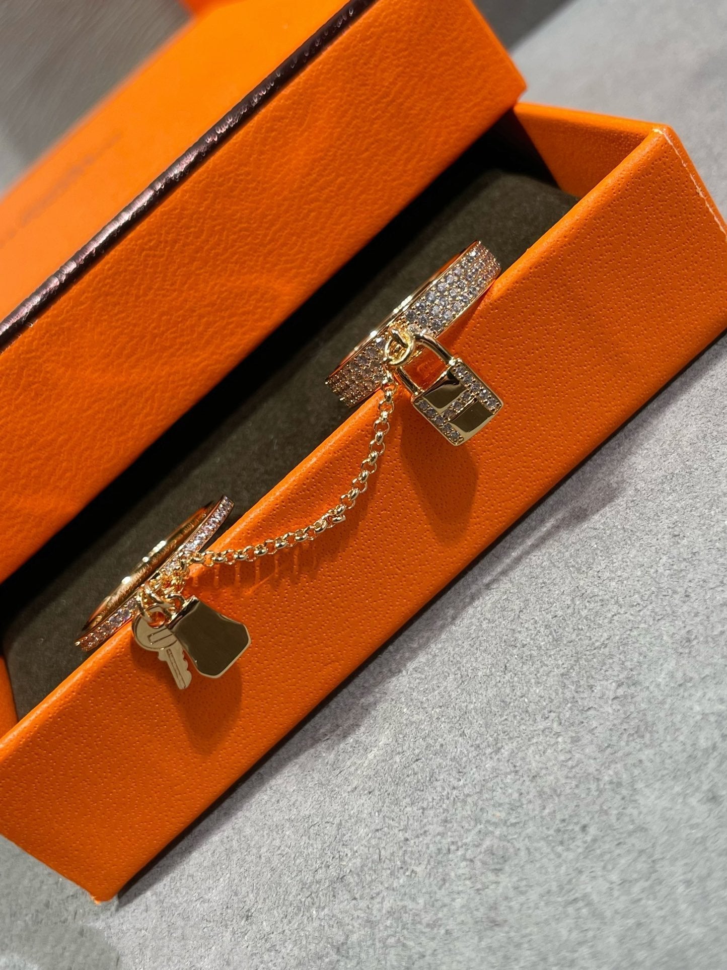HERMES HM KELLY CLOCHETTE DOUBLE RING IN ROSE GOLD WITH DIAMONDS