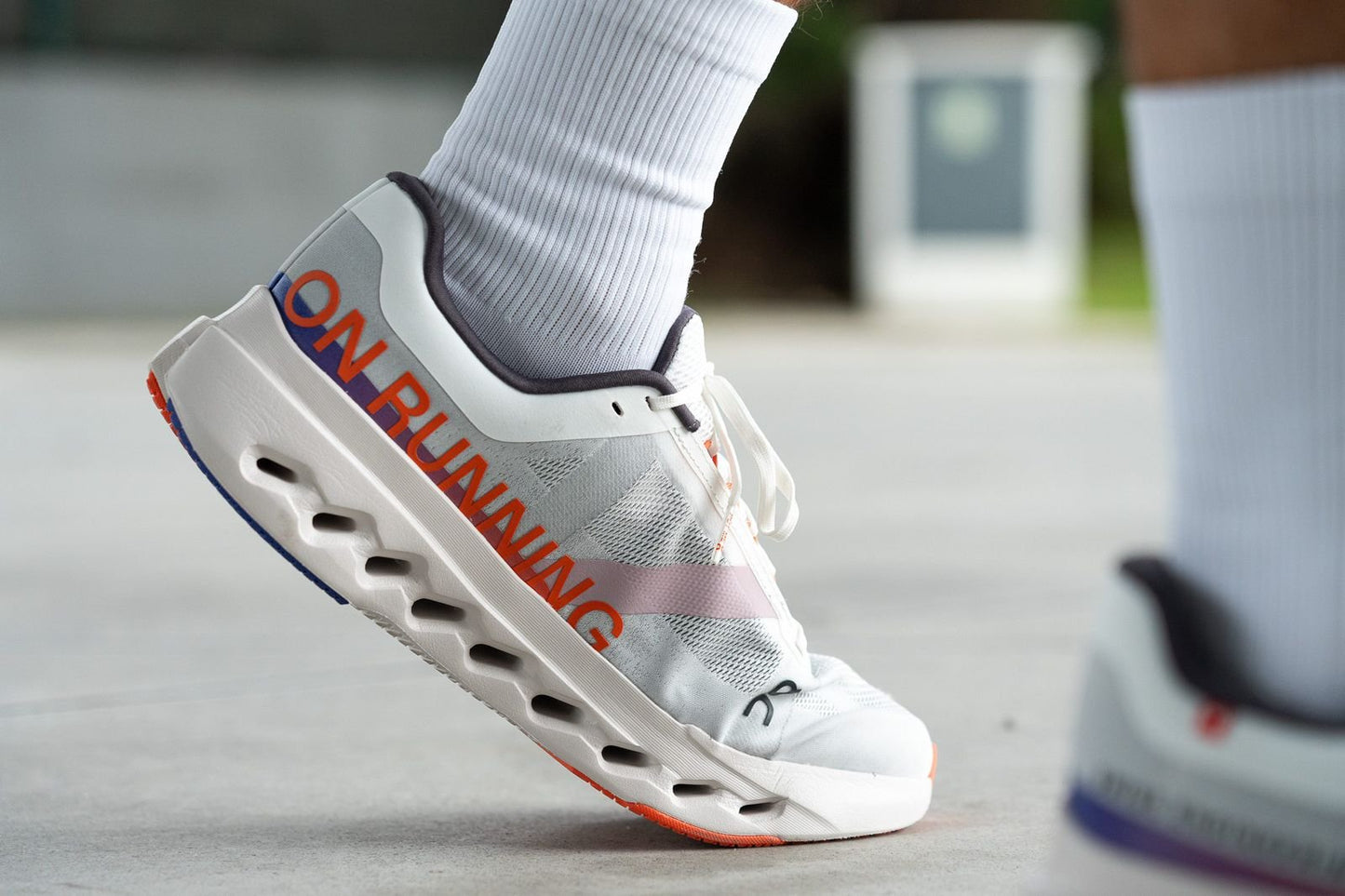 On Cloudsurfer Next white orange