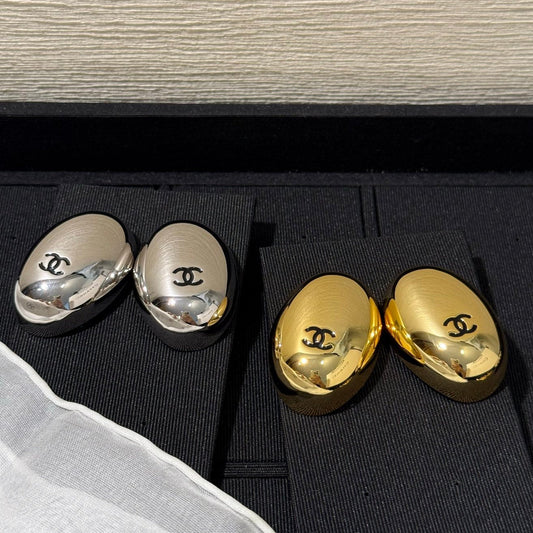 Chanel 2026 Mirror Black Enamel Double C Oval Pigeon Egg Earrings