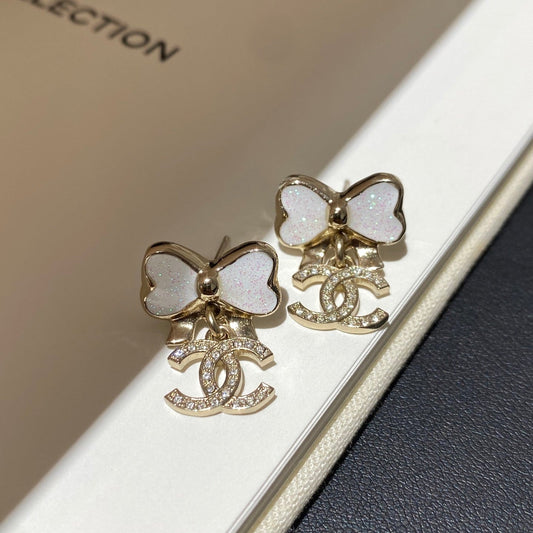 Chanel Fine Sparkling Bow Gold Mop Earrings