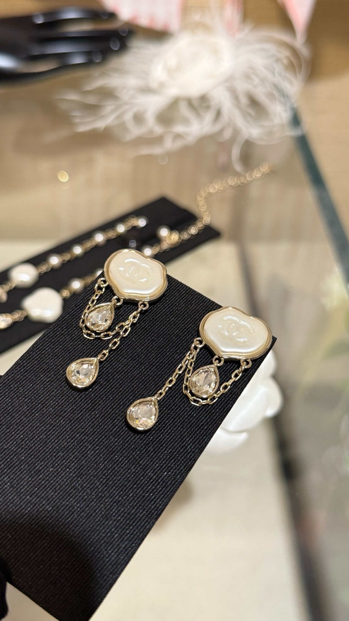 Chanel Cloud Double C Resin Double Teardrop Crystal Light Gold Chain Tassel Earrings
