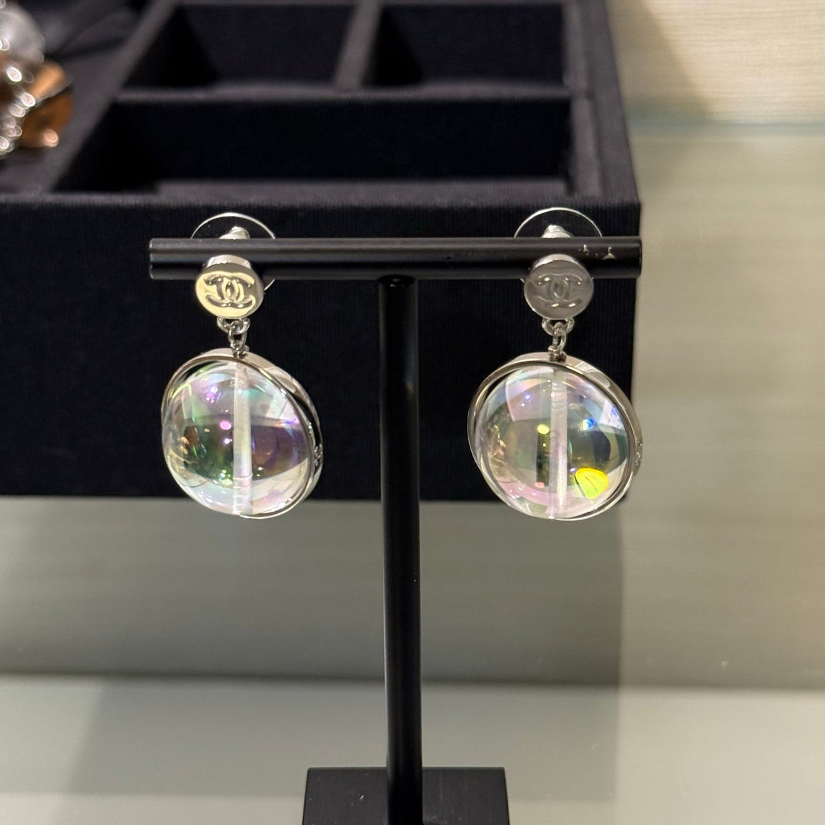 Chanel 2026 Transparent Iridescent Crystal Ball Planet Silver Button Double C Earrings