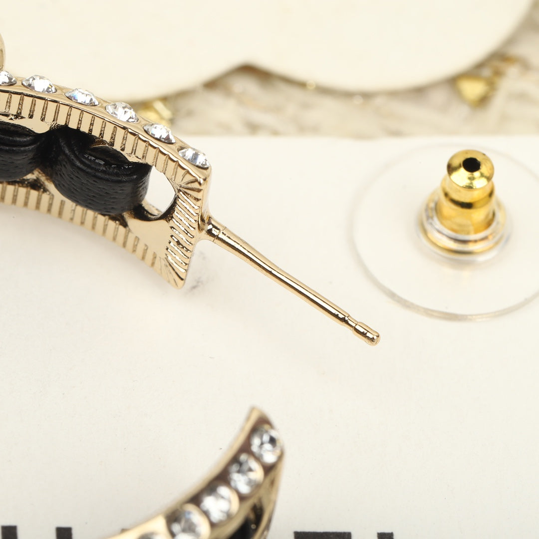 Chanel Double C Gold Leather Curved Hook Stud Earrings